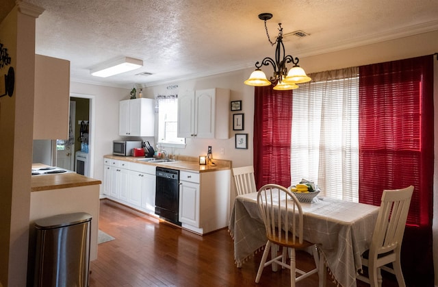 269 E Chance Rd, Lumberton, TX 77657 - kitchen featuring black dishwasher, a sink, a chandelier, white cabinetry, and stainless steel microwave