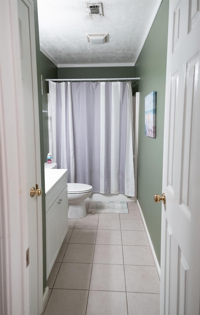 269 E Chance Rd, Lumberton, TX 77657 - full bath with a textured ceiling, vanity, toilet, tile patterned floors, and ornamental molding