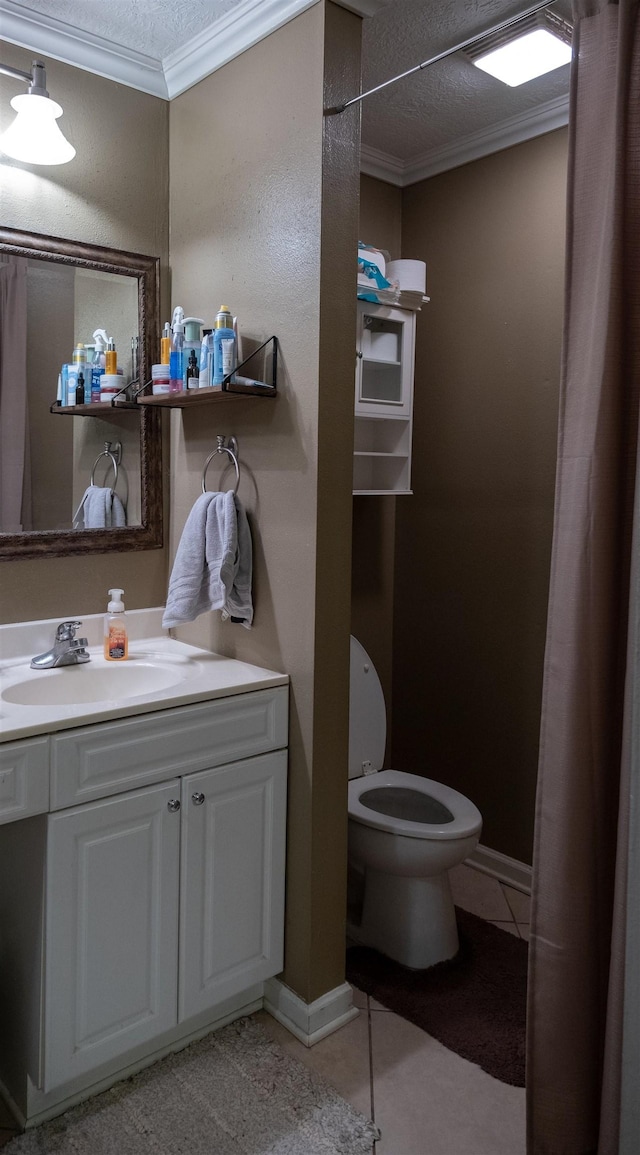 269 E Chance Rd, Lumberton, TX 77657 - bathroom with crown molding, toilet, vanity, tile patterned flooring, and a textured ceiling