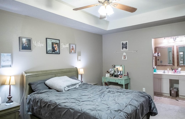 269 E Chance Rd, Lumberton, TX 77657 - bedroom featuring connected bathroom, light tile patterned flooring, and ceiling fan