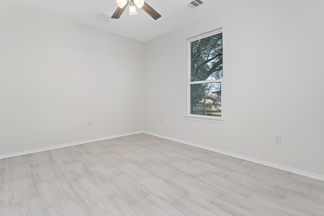 spare room with ceiling fan