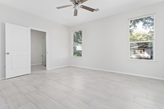 spare room with ceiling fan