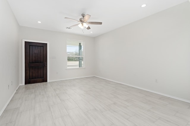 spare room with ceiling fan