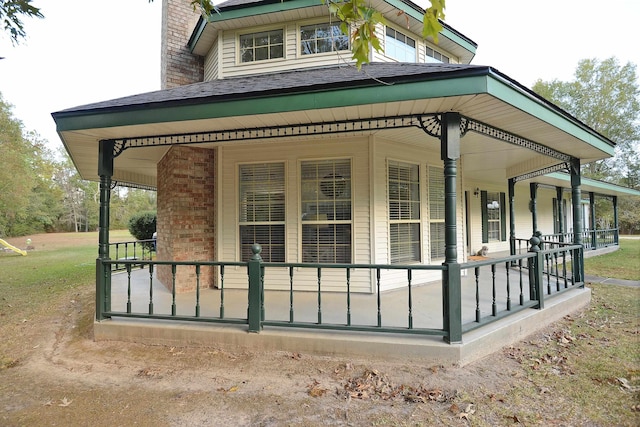 view of side of property with a porch