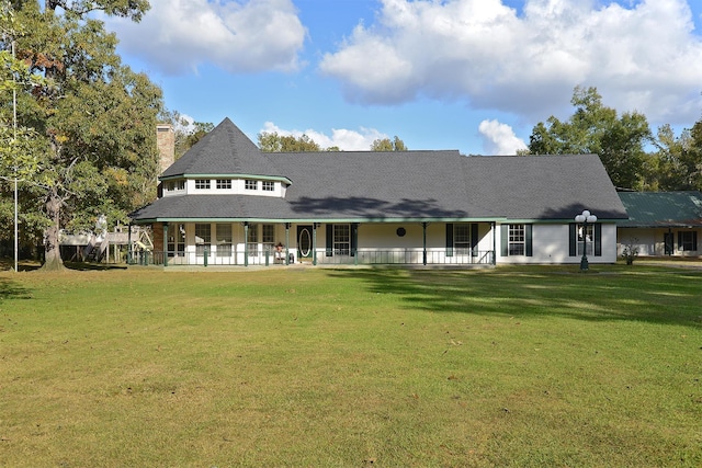 back of house with a lawn