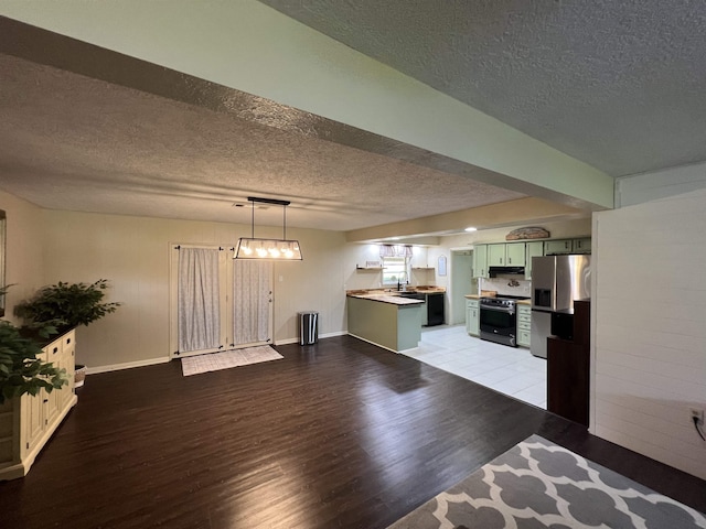 100 Cypress Bnd, Village Mills, TX 77663 - unfurnished living room with a textured ceiling and light wood finished floors