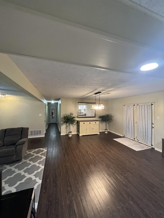 100 Cypress Bnd, Village Mills, TX 77663 - living area with baseboards and dark wood-type flooring