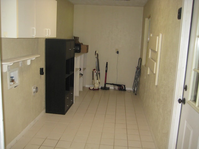 100 Cypress Bnd, Village Mills, TX 77663 - laundry room with cabinet space, light tile patterned flooring, washer hookup, and electric dryer hookup