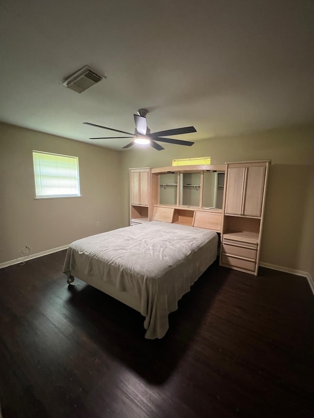 100 Cypress Bnd, Village Mills, TX 77663 - bedroom with dark wood-style flooring and a ceiling fan