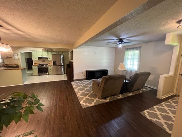 100 Cypress Bnd, Village Mills, TX 77663 - living area with a textured ceiling, dark wood finished floors, and ceiling fan