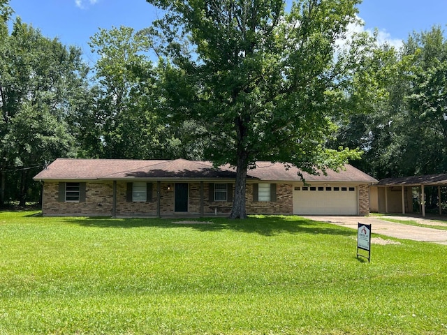 100 Cypress Bnd, Village Mills, TX 77663 - view of front facade with a garage, a front lawn, concrete driveway, and brick siding