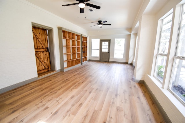 interior space featuring ceiling fan, light hardwood / wood-style flooring, and ornamental molding