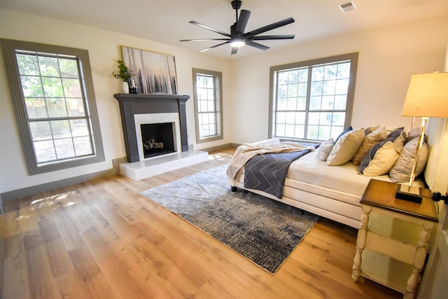 bedroom with hardwood / wood-style flooring and ceiling fan