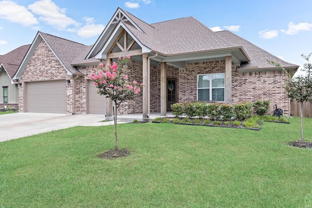 view of front of home featuring a garage and a front lawn