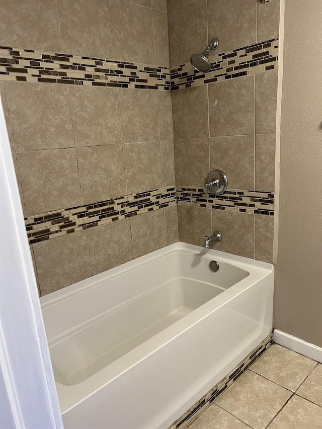 bathroom with tile patterned floors and tiled shower / bath combo