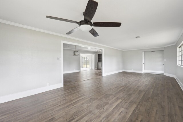 unfurnished living room with baseboards, dark wood-type flooring, ceiling fan, and crown molding