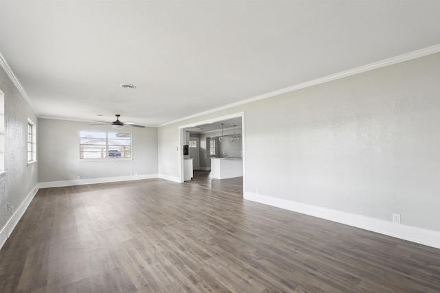 unfurnished living room with a ceiling fan, baseboards, ornamental molding, and dark wood-style floors