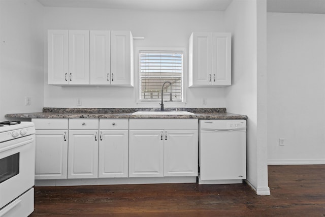 815 N 14th St, Nederland, TX 77627 - kitchen featuring white appliances, a sink, white cabinetry, dark wood finished floors, and dark countertops