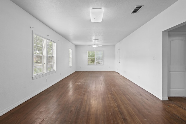 815 N 14th St, Nederland, TX 77627 - unfurnished room featuring dark wood finished floors, ceiling fan, and baseboards