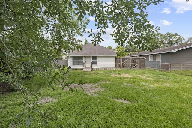 815 N 14th St, Nederland, TX 77627 - view of yard featuring a gate and entry steps