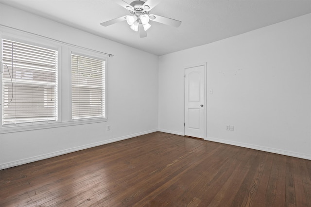 815 N 14th St, Nederland, TX 77627 - spare room with dark wood-type flooring, a ceiling fan, and baseboards