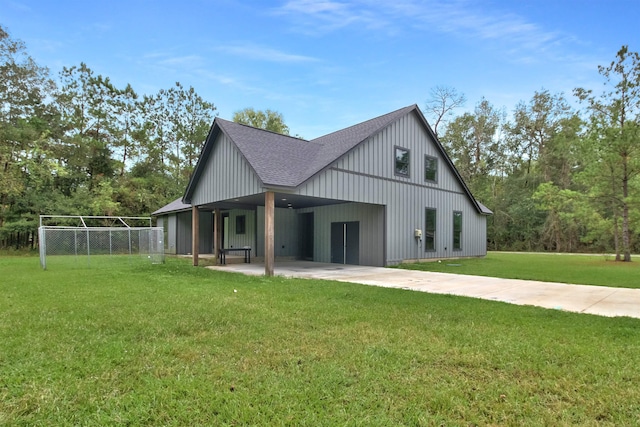 view of property exterior featuring a carport and a yard