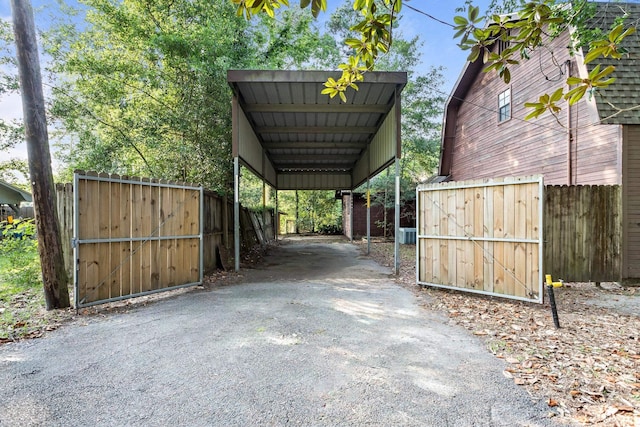 134 Sherwood Trl, Silsbee, TX 77656 - view of parking / parking lot featuring driveway and a carport