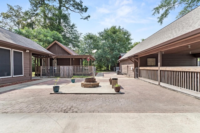 134 Sherwood Trl, Silsbee, TX 77656 - view of patio featuring a fire pit
