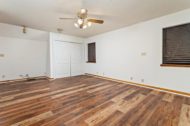 134 Sherwood Trl, Silsbee, TX 77656 - unfurnished bedroom featuring wood finished floors, baseboards, a closet, and a ceiling fan