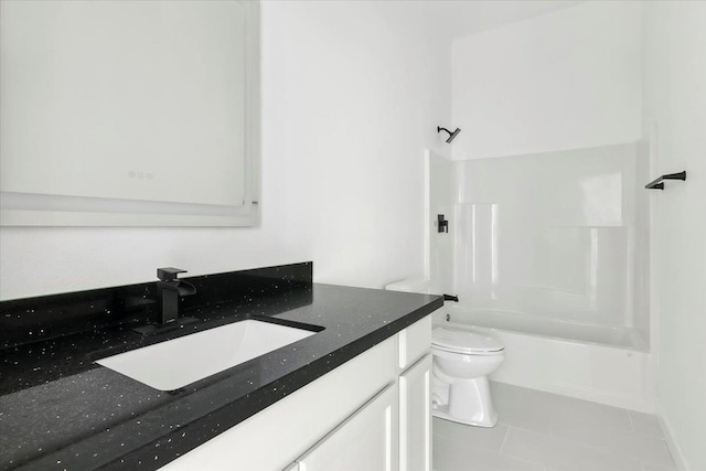 full bathroom featuring tile patterned floors, vanity, toilet, and tub / shower combination