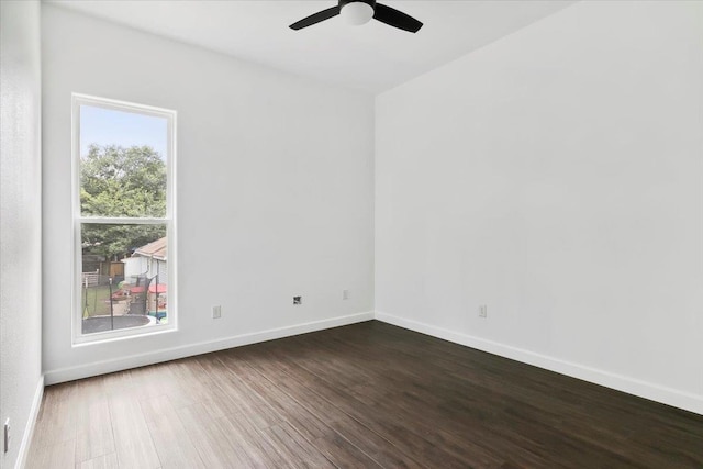 spare room featuring hardwood / wood-style flooring and ceiling fan