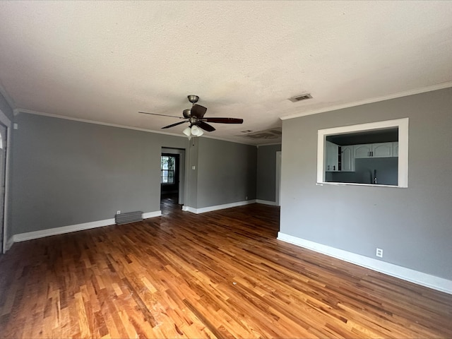 unfurnished room featuring crown molding, hardwood / wood-style floors, ceiling fan, and a textured ceiling