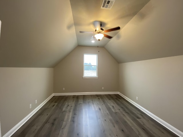 additional living space with dark hardwood / wood-style flooring, ceiling fan, and lofted ceiling