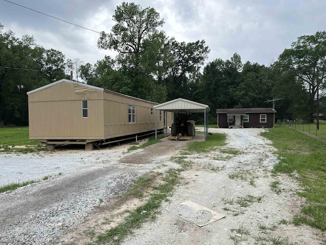 view of front of home with a carport