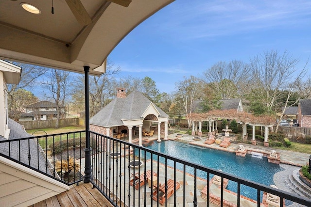 view of pool with an outbuilding