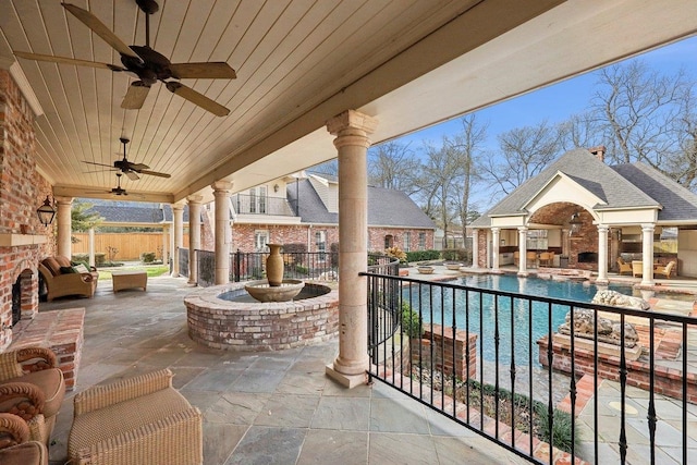 view of patio / terrace featuring a fenced in pool and an outbuilding