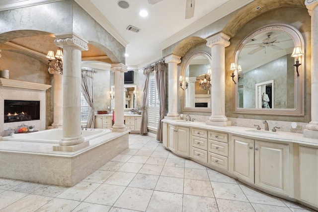 bathroom with ornate columns, vanity, and ceiling fan