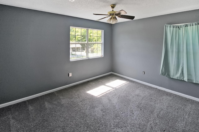 spare room featuring a textured ceiling, ceiling fan, baseboards, and carpet