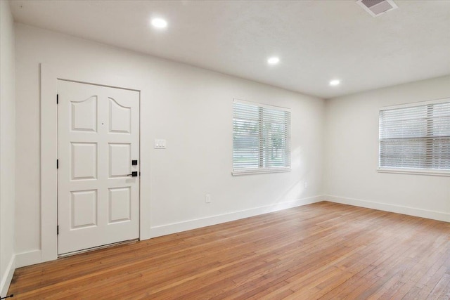 foyer entrance with light wood-type flooring