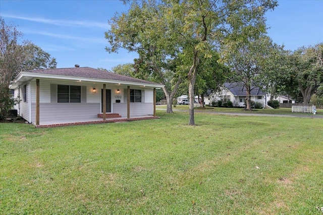 single story home featuring a front yard