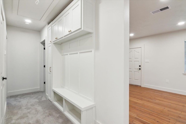 mudroom with light carpet