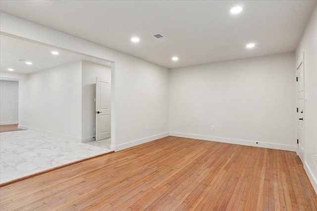 spare room with light wood-type flooring