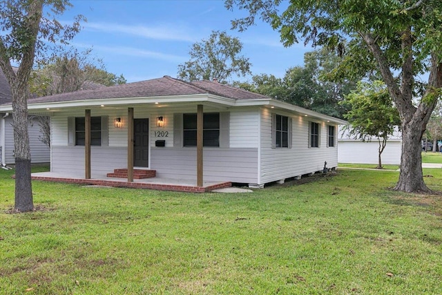 single story home featuring a porch and a front yard