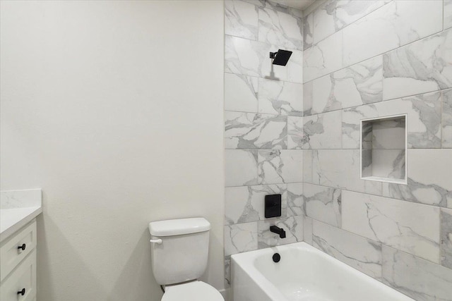 full bathroom featuring vanity, toilet, and tiled shower / bath