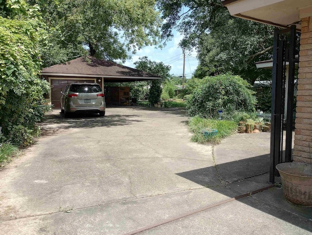 view of car parking with a garage