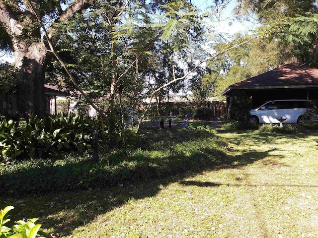 view of yard featuring a carport