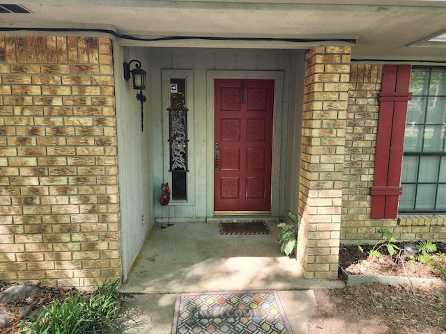 property entrance featuring visible vents