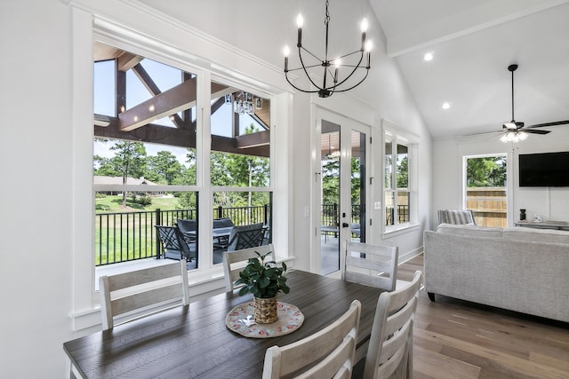 dining room featuring recessed lighting, wood finished floors, vaulted ceiling with beams, and ceiling fan with notable chandelier