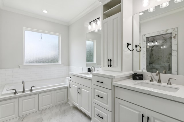 bathroom featuring a garden tub, marble finish floor, a marble finish shower, crown molding, and vanity