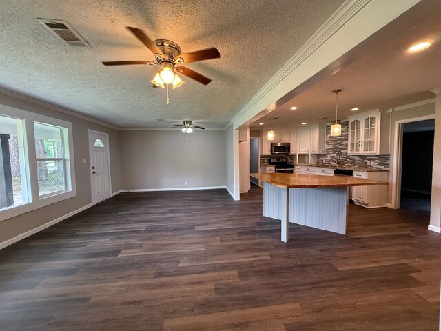 2370 Central Dr, Beaumont, TX 77706 - kitchen with butcher block countertops, appliances with stainless steel finishes, ornamental molding, open floor plan, and a ceiling fan
